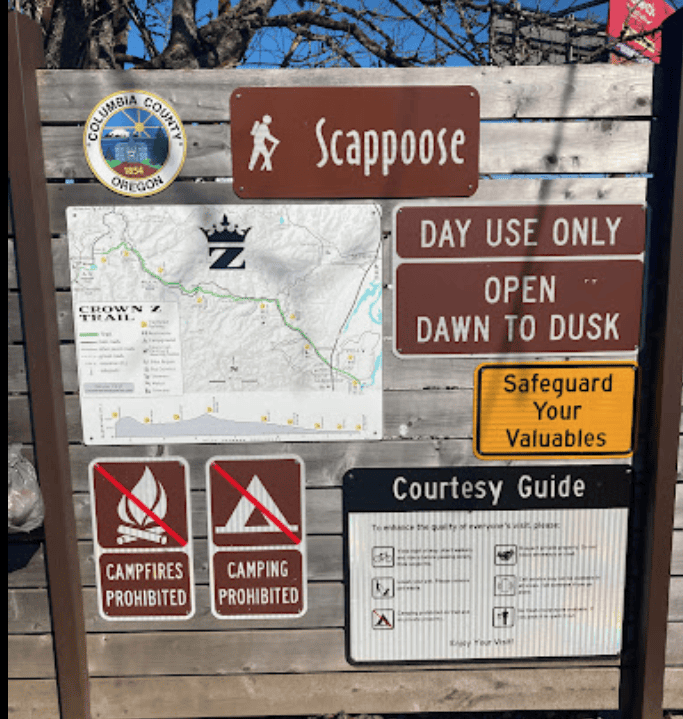 Campnatural pest control, hiking trail map at Scappoose with rules and safety signs, promoting eco-friendly pest management in Oregon.